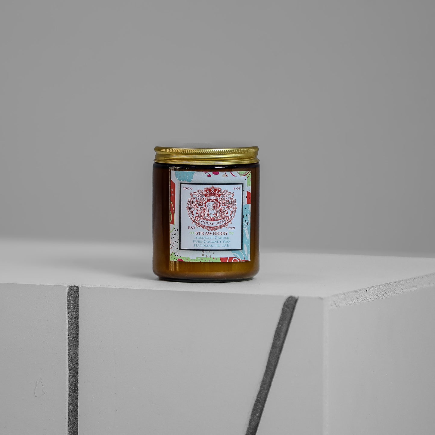 Amber glass jar with gold lid—House 1988 Strawberry Absolute Candle (200 g), pure coconut wax, handmade in the UAE.