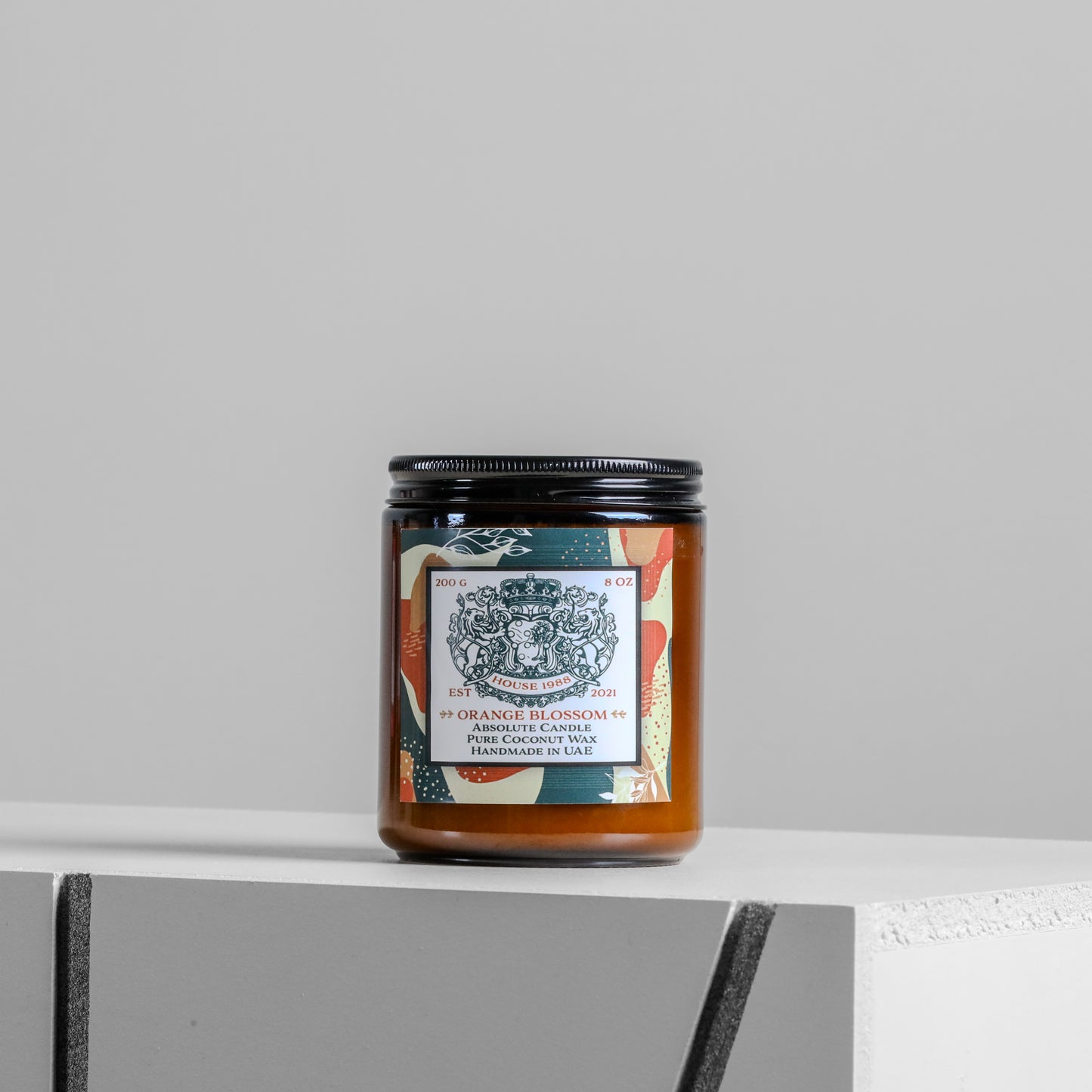House 1988 Orange Blossom Absolute candle, 200g amber jar with black lid and teal patterned label, coconut wax