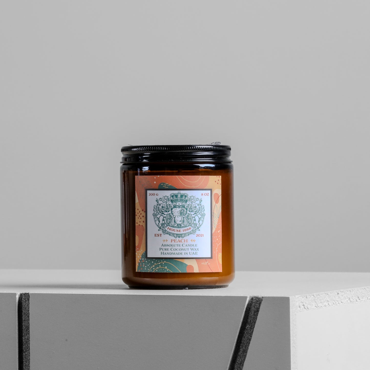 House 1988 Peach Absolute candle, 200g amber jar with black lid and green crest label, pure coconut wax